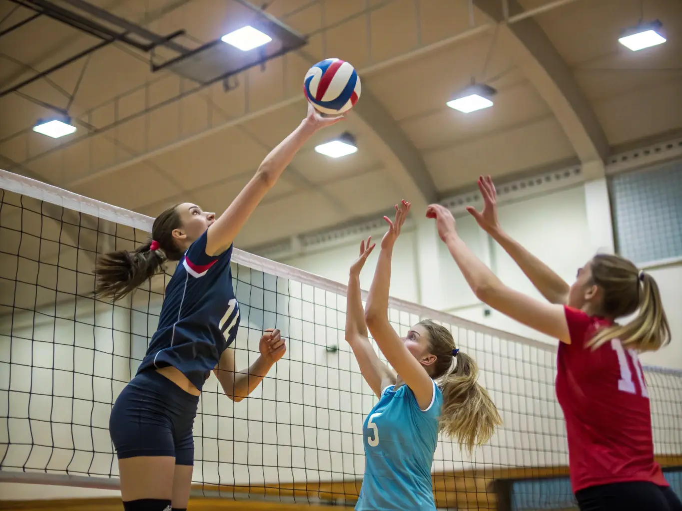 A lively scene of a group playing a leisure sport like badminton or volleyball in a community hall, showcasing teamwork and friendly competition.